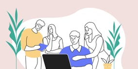 The Articulate team working together around a laptop